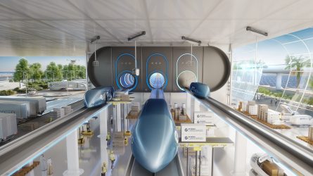 Cylinderliknande tåg i en transporthall i framtiden.